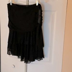 Black silk skirt.